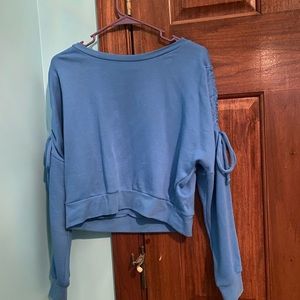 Blue sweater with drawstring on sides of arm